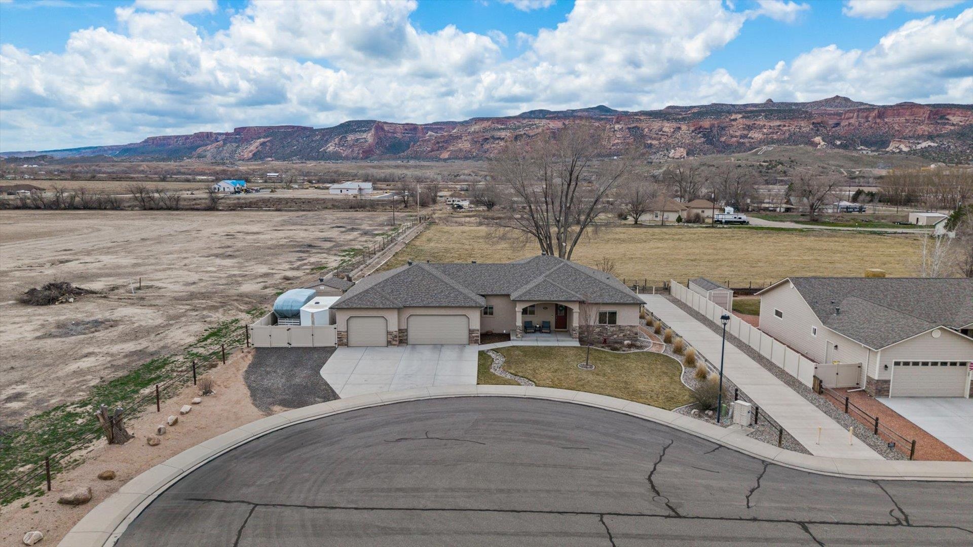 686 Beech Avenue Fruita, CO 81521 - Photo 4 of 33 a view of a lake with a mountain in the background