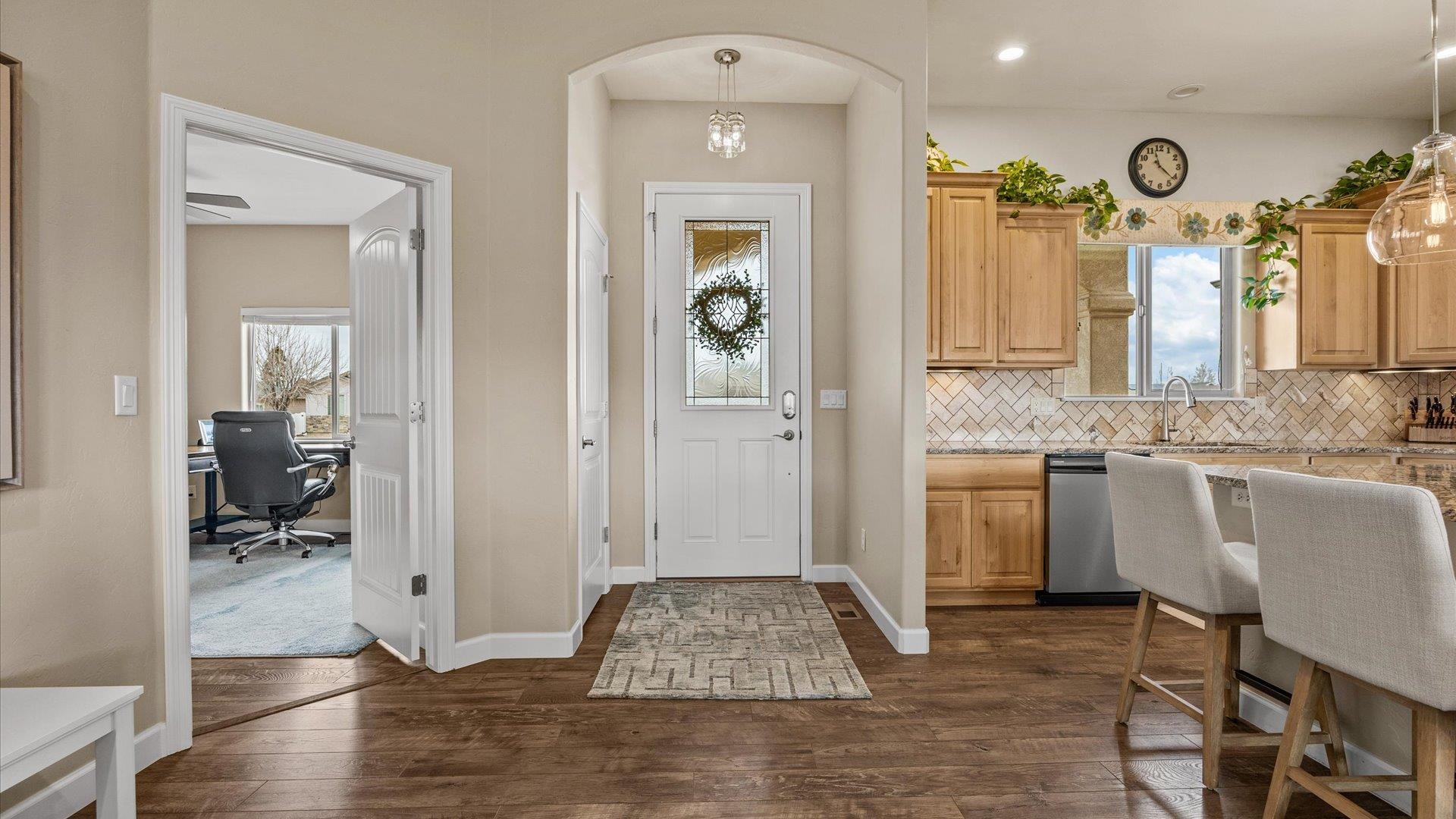 686 Beech Avenue Fruita, CO 81521 - Photo 9 of 33 a bathroom with a granite countertop sink a mirror and shower