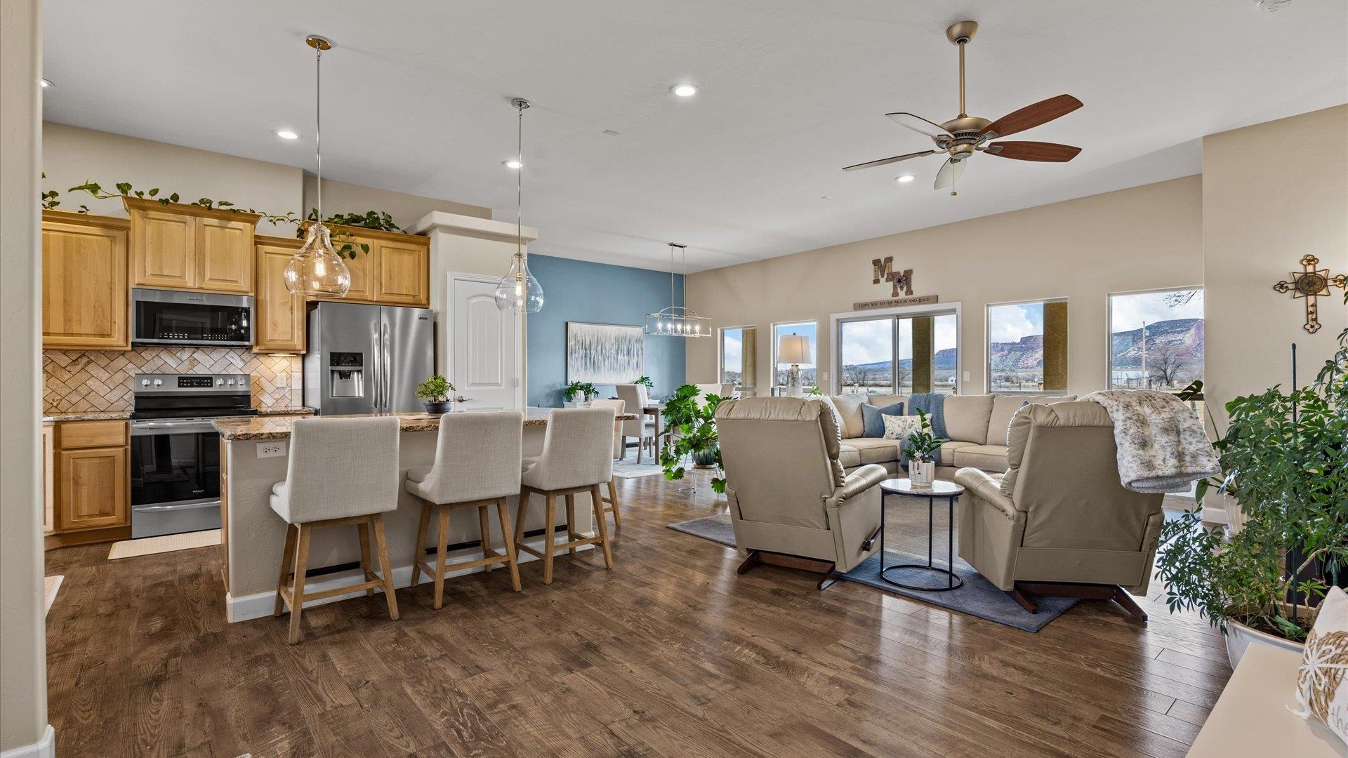 686 Beech Avenue Fruita, CO 81521 - Photo 10 of 33 a view of a dining room with furniture window and wooden floor