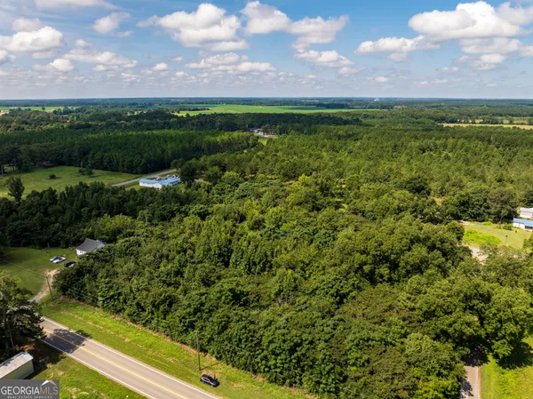a view of a yard with an outdoor space and seating area