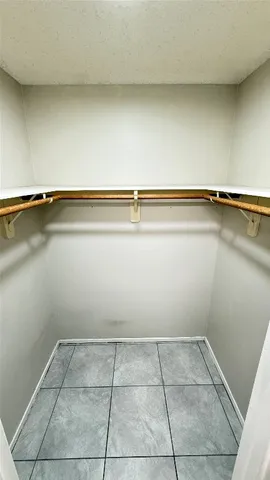 a utility room with dryer washer and a view of kitchen