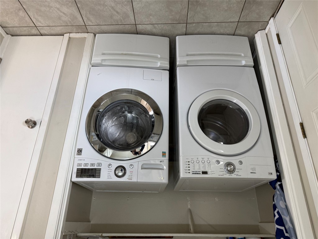 107 Owen Circle Georgetown, TX 78626 - Photo 10 of 13 a utility room with dryer washer and a view of kitchen