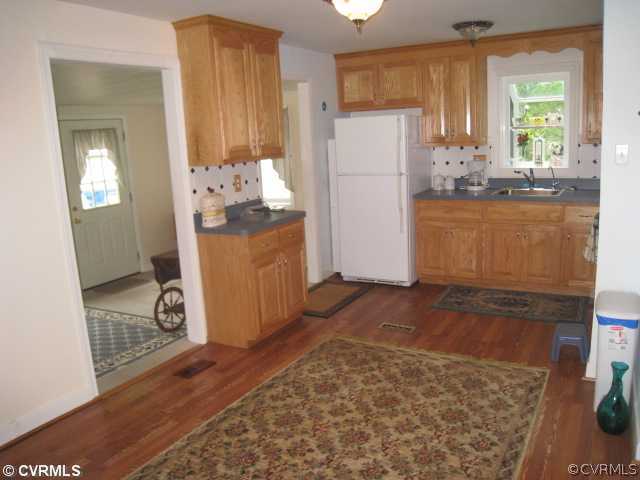 8191 Varina Road Henrico, VA 23231 - Photo 3 of 11 a kitchen with refrigerator and window