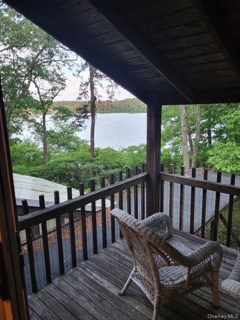 a view of a two chairs in the deck