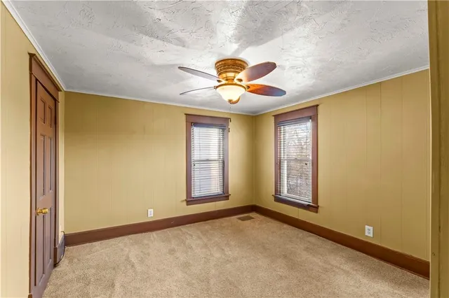 a view of a livingroom with a chandelier fan