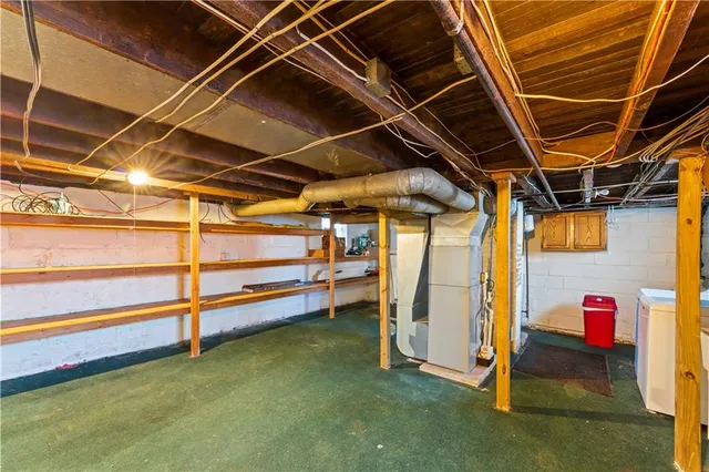 a view of an empty room with staircase