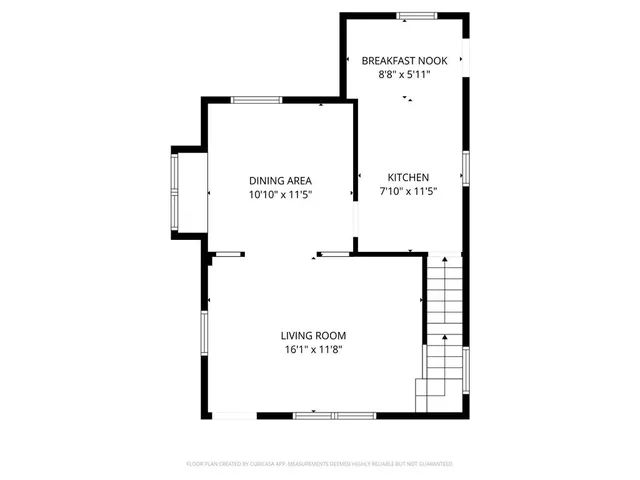 a picture of a bench in front of a wall