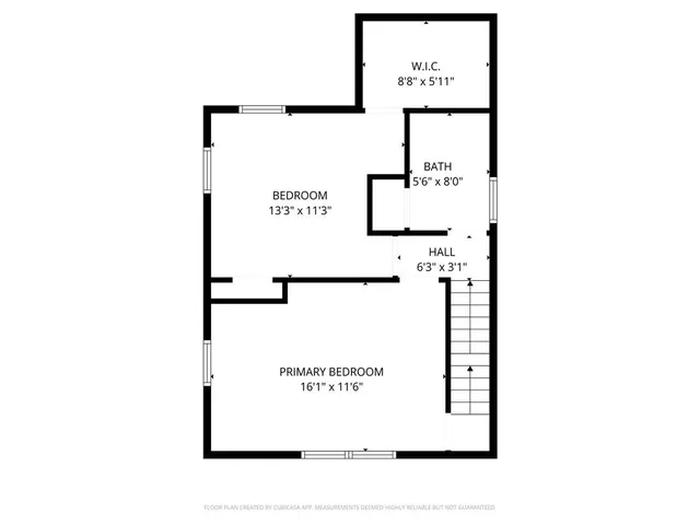 a picture of a bathroom with a white wall