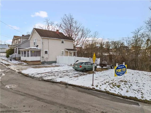 a view of a street with view of a house