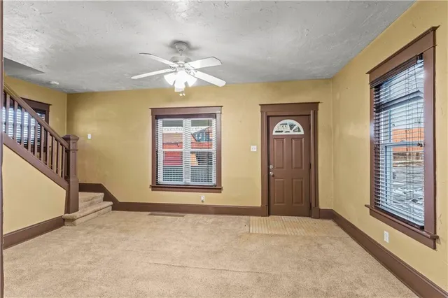 a view of an empty room with a window