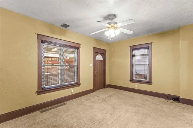 a view of an empty room with a window