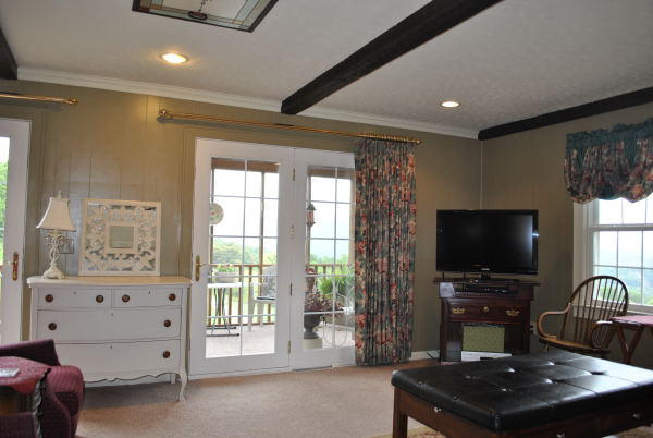 3467 Half Acre Of Rocks Road Elliston, VA 24087 - Photo 12 of 61 a living room with furniture and a flat screen tv