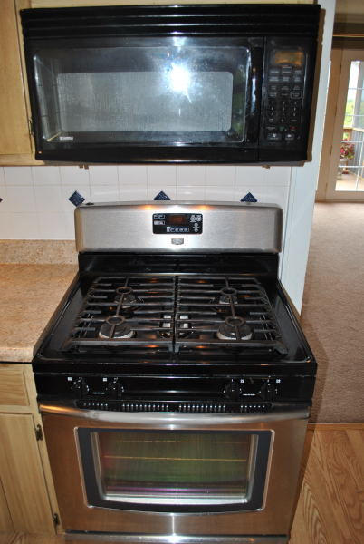 3467 Half Acre Of Rocks Road Elliston, VA 24087 - Photo 17 of 61 a stove top oven sitting inside of a kitchen