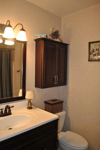 3467 Half Acre Of Rocks Road Elliston, VA 24087 - Photo 30 of 61 a bathroom with a granite countertop toilet sink and mirror