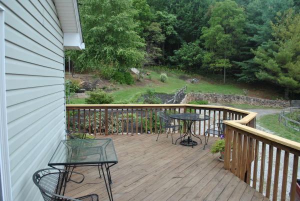 3467 Half Acre Of Rocks Road Elliston, VA 24087 - Photo 40 of 61 a view of a balcony with chairs and wooden floor