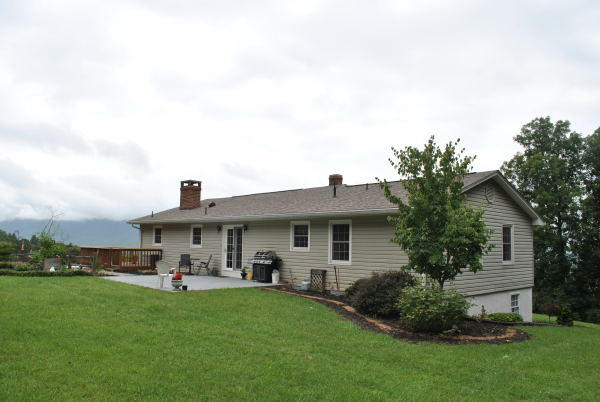 3467 Half Acre Of Rocks Road Elliston, VA 24087 - Photo 44 of 61 a front view of a house with a garden and plants