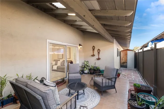 a outdoor living space with furniture and a potted plant