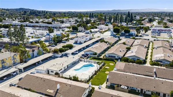 an aerial view of residential houses with outdoor space