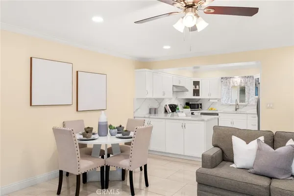 a kitchen with stainless steel appliances kitchen island granite countertop a sink and cabinets