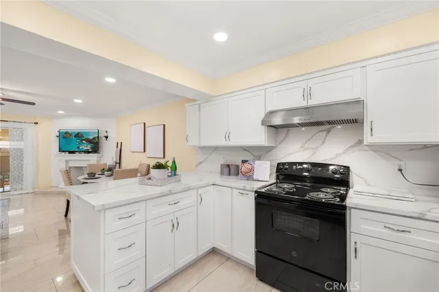 a kitchen with a sink stove and cabinets
