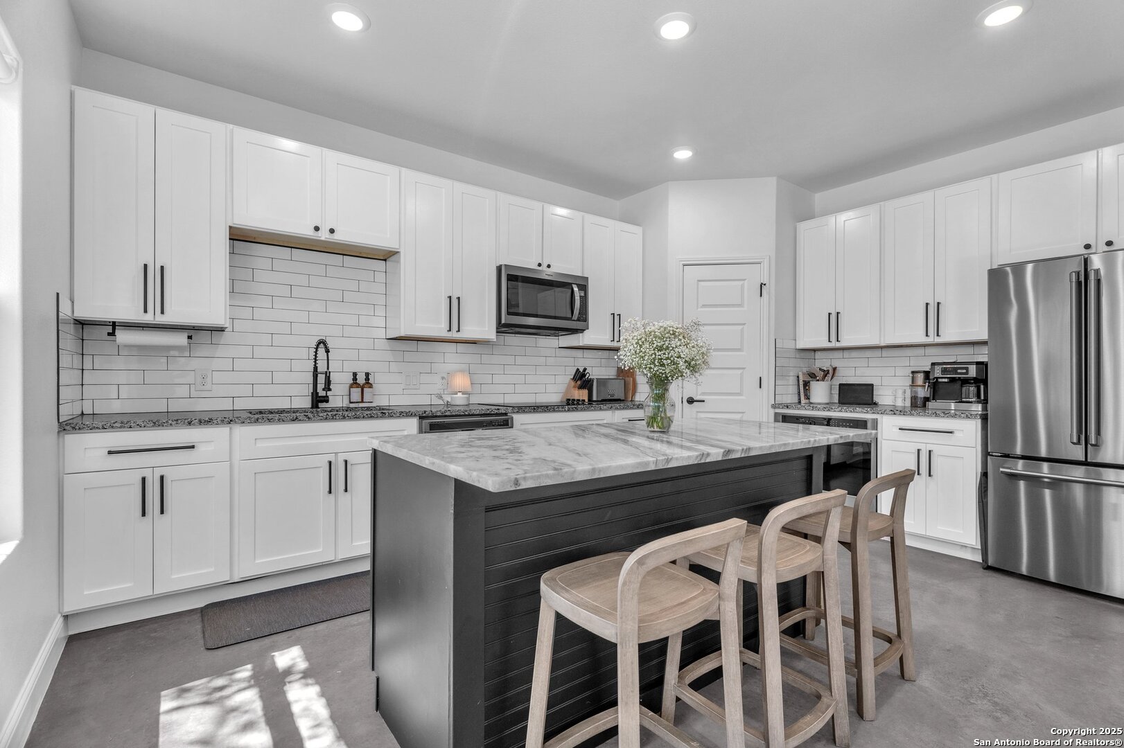 348 Fawn Drive Spring Branch, TX 78070 - Photo 15 of 48 a kitchen with refrigerator cabinets dining table and chairs