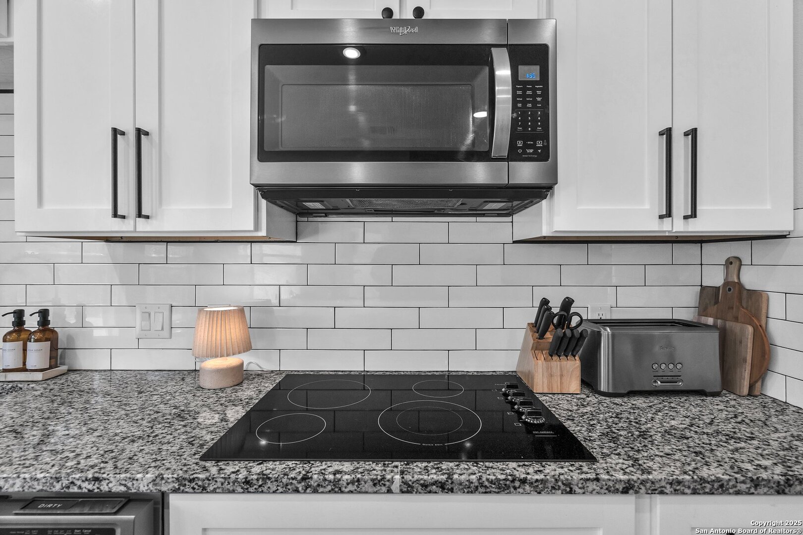 348 Fawn Drive Spring Branch, TX 78070 - Photo 21 of 48 a kitchen with a stove microwave and sink
