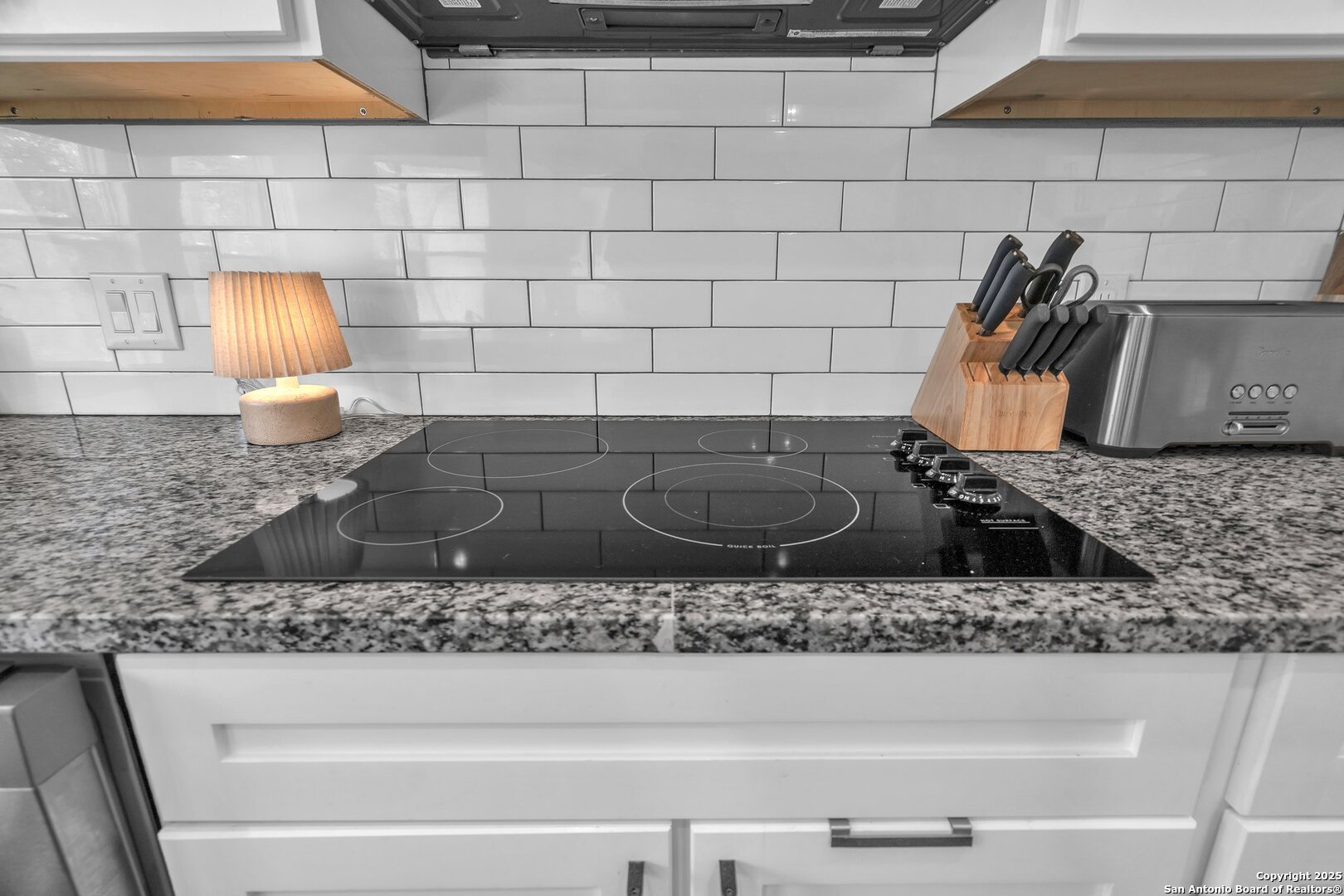 348 Fawn Drive Spring Branch, TX 78070 - Photo 22 of 48 a bathroom with a granite countertop sink and a stove