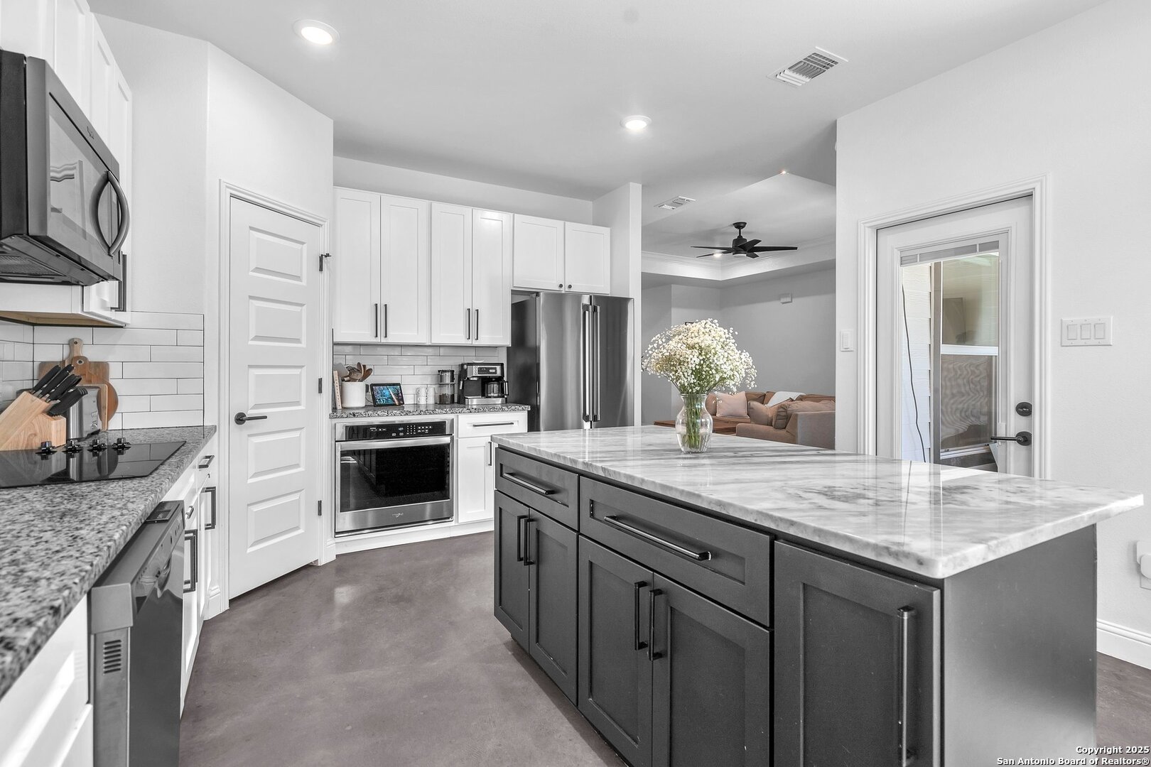 348 Fawn Drive Spring Branch, TX 78070 - Photo 23 of 48 a kitchen with kitchen island granite countertop a sink stove and refrigerator