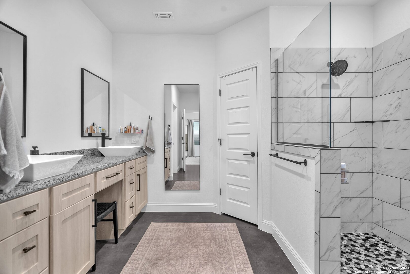 348 Fawn Drive Spring Branch, TX 78070 - Photo 29 of 48 a spacious bathroom with a double vanity sink a mirror and a shower
