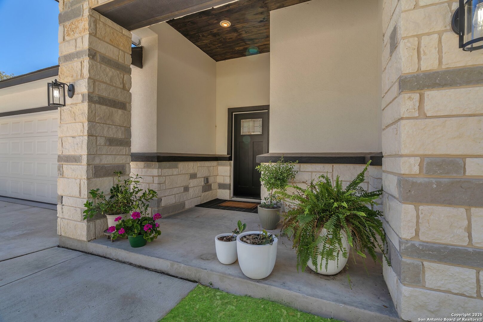 348 Fawn Drive Spring Branch, TX 78070 - Photo 4 of 48 a view of a flower garden with potted plants