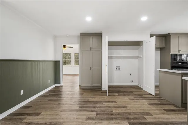 a view of a kitchen cabinets and wooden floor