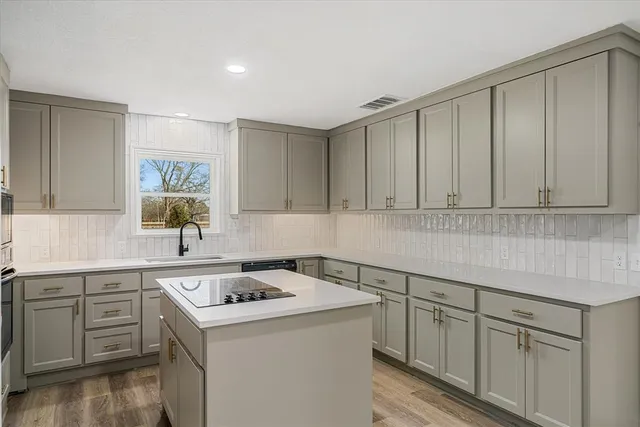 a view of a kitchen with cabinets