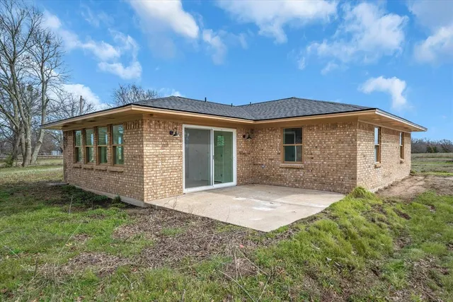 a front view of a house with yard