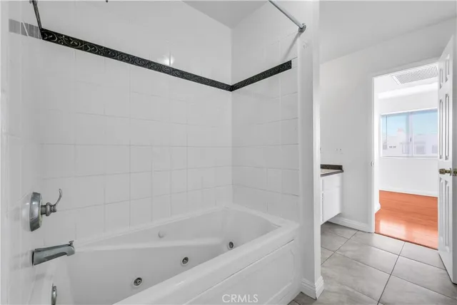 a bathroom with a bathtub and shower