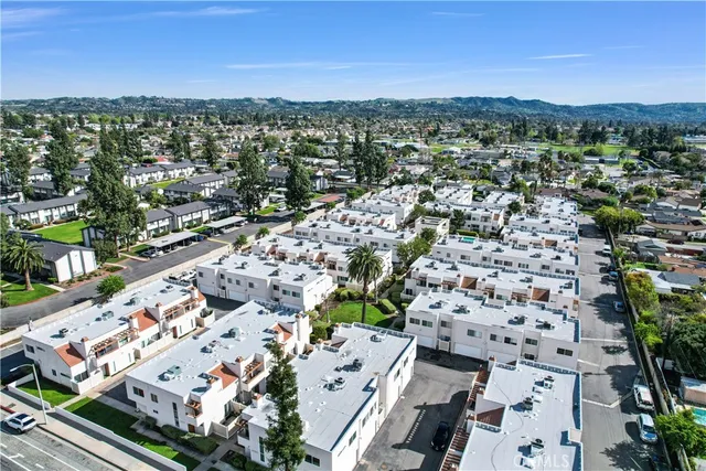 an aerial view of a city with lots of residential buildings