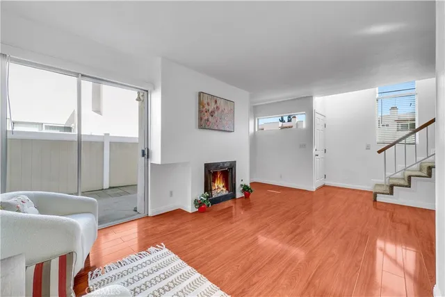 a bedroom with a bed and a fireplace