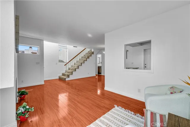 a view of an entryway with wooden floor
