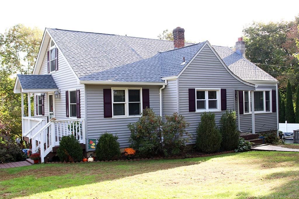 a view of a house with a yard and plants