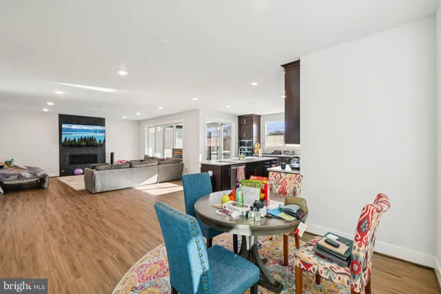 a kitchen with stainless steel appliances granite countertop a stove a refrigerator and a microwave