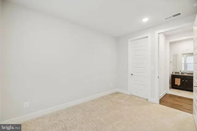 a view of an empty room and a window