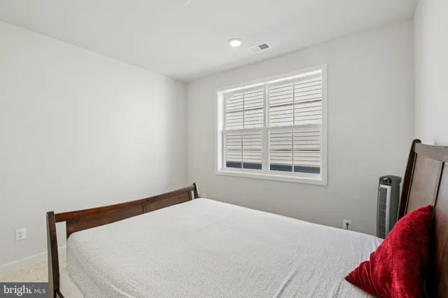 a view of walk in closet with clothes