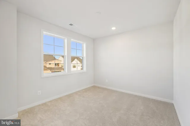 a bedroom with a bed and dresser