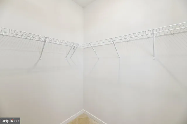 a bedroom with a bed and a lamp