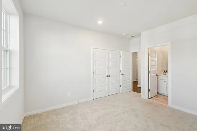 a living room with furniture rug and wooden floor