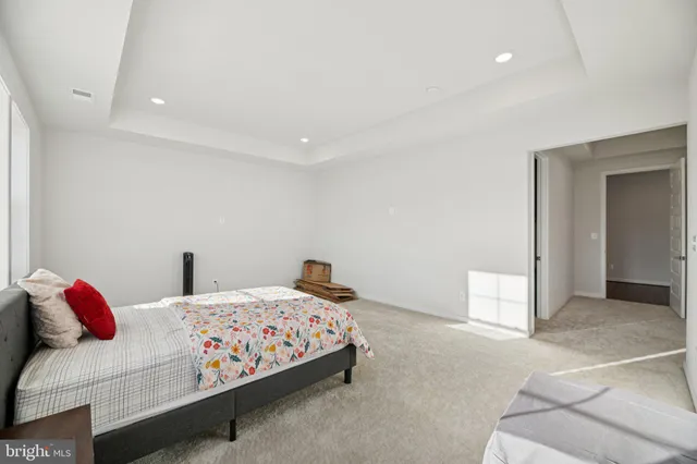 a bathroom with a sink mirror and a bathtub