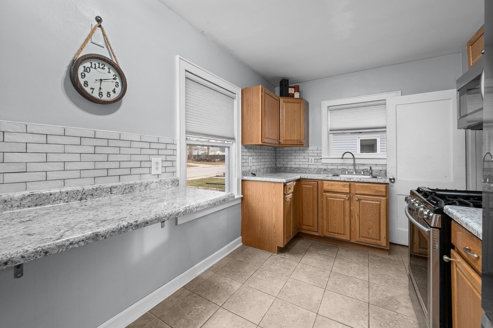 2517 3rd Street East Moline, IL 61244 - Photo 11 of 22 a kitchen with a sink cabinets and a stove top oven