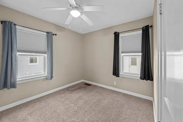 a view of a room that has a window in it