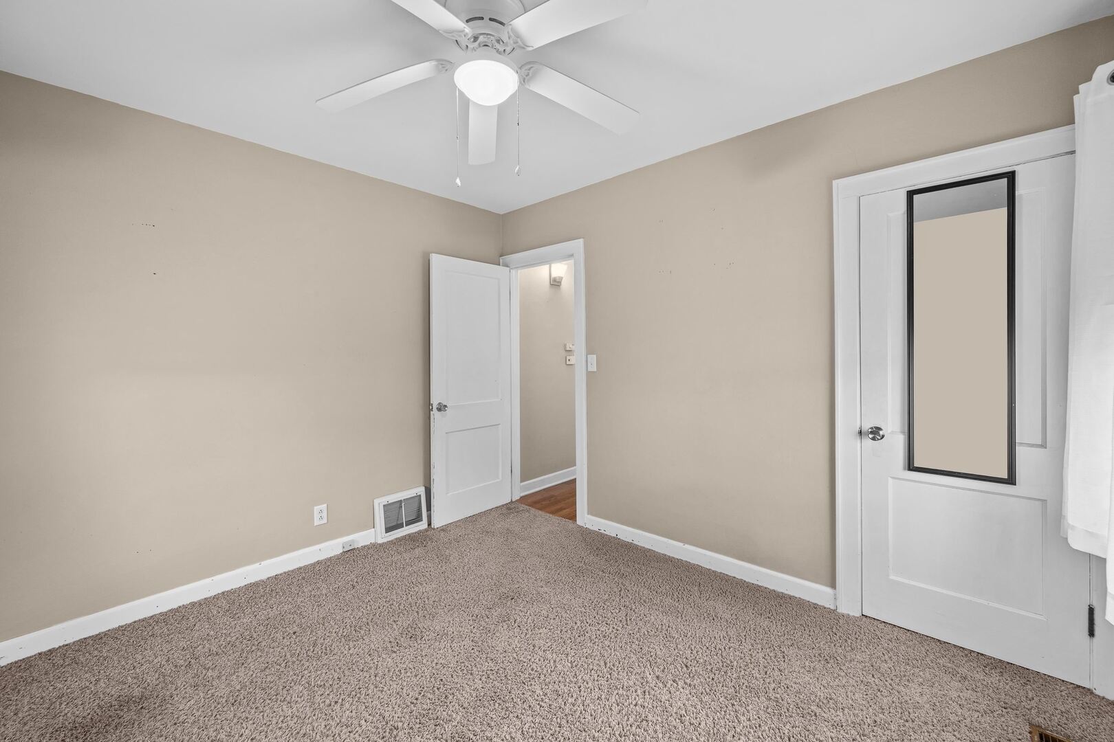 2517 3rd Street East Moline, IL 61244 - Photo 15 of 22 an empty room with a fan & a ceiling fan