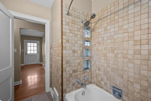 a bathroom with a shower and a sink