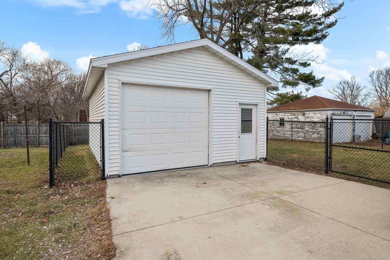 2517 3rd Street East Moline, IL 61244 - Photo 20 of 22 a view of a house with a backyard